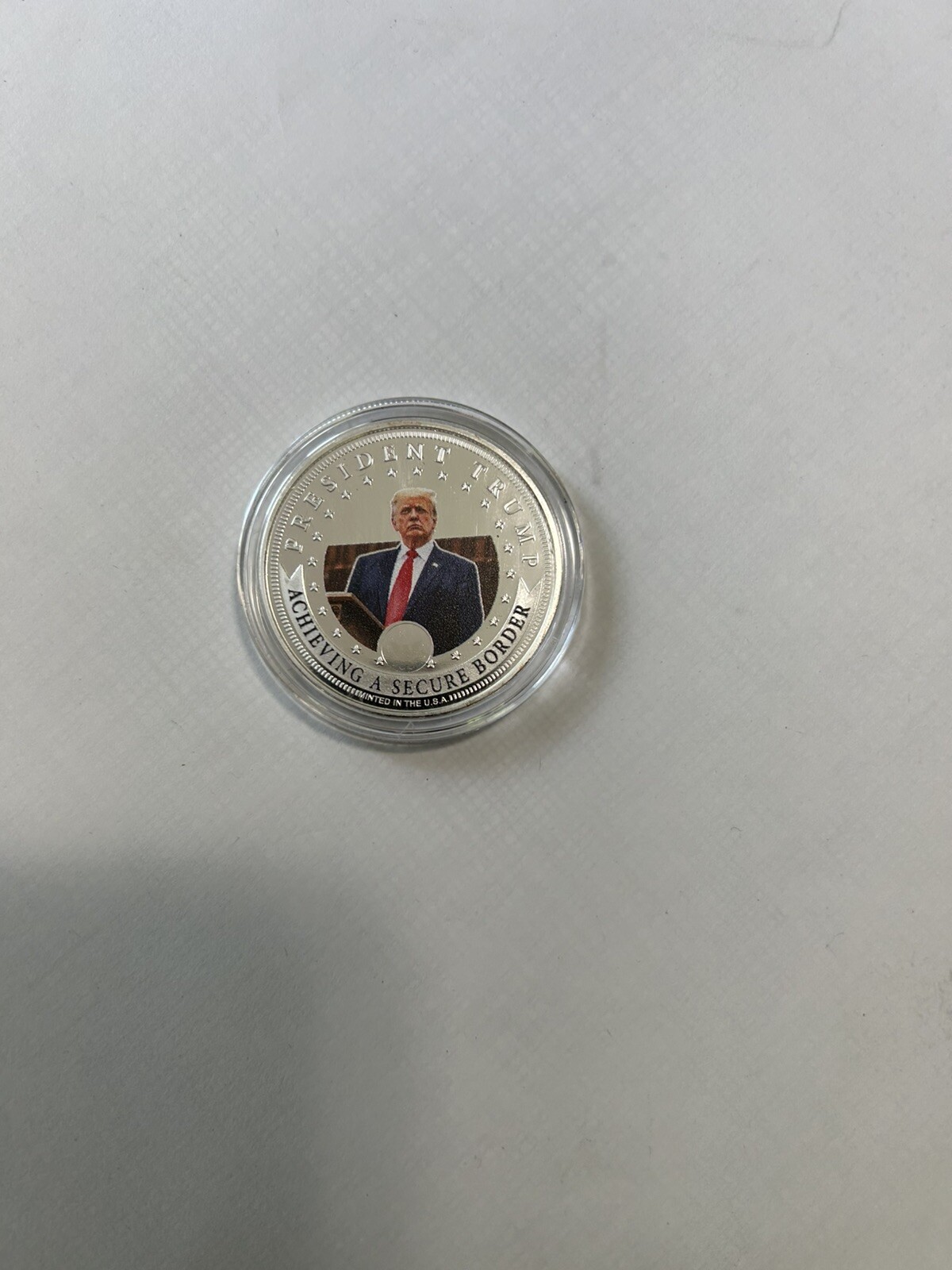 Two 2024 Donald J. Trump 99.9% Silver-Plated Proof Coins And 15 Coin Holder Case