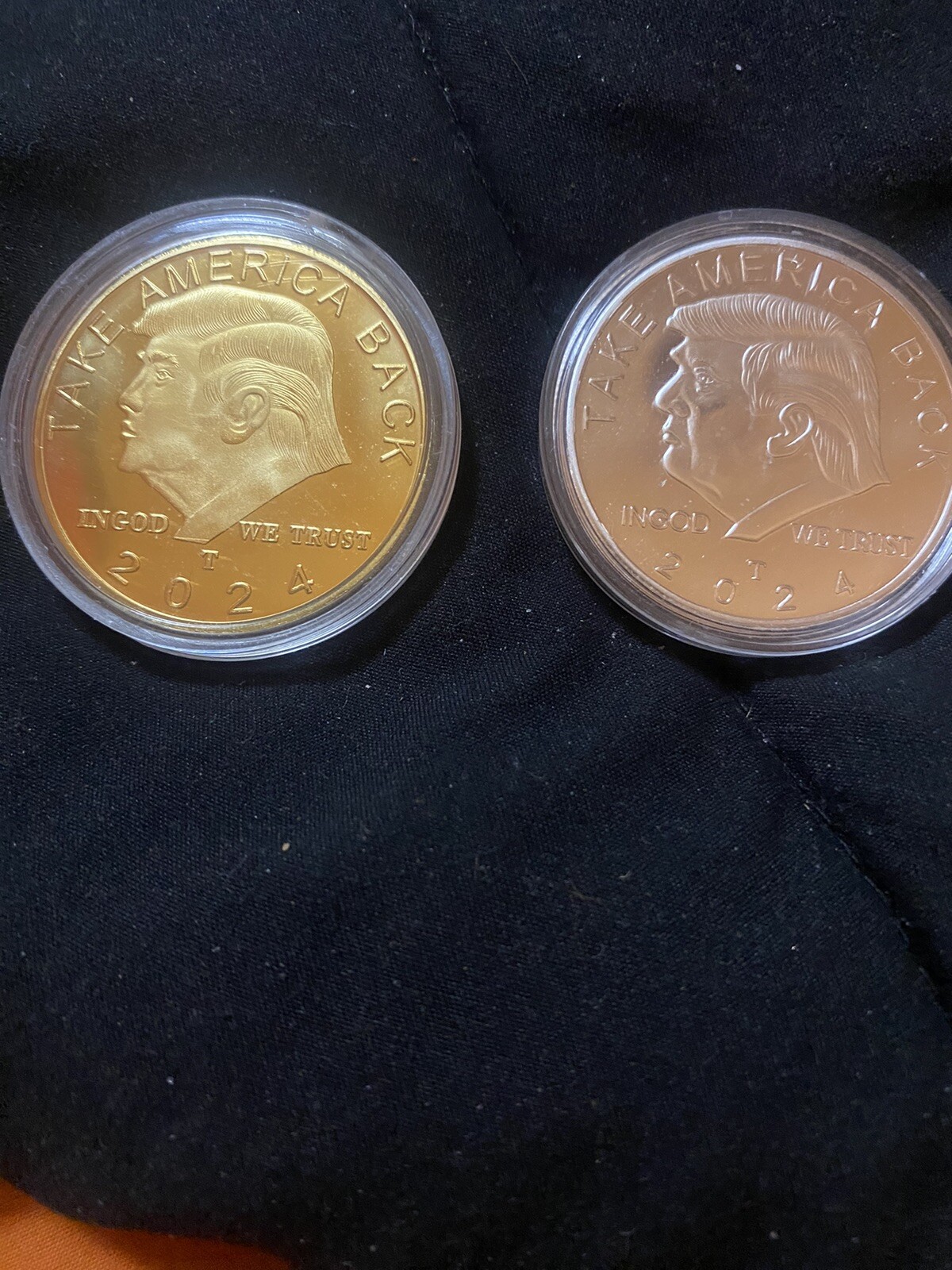 Pair of Donald Trump 2024 gold and silver Clad take America back coins.