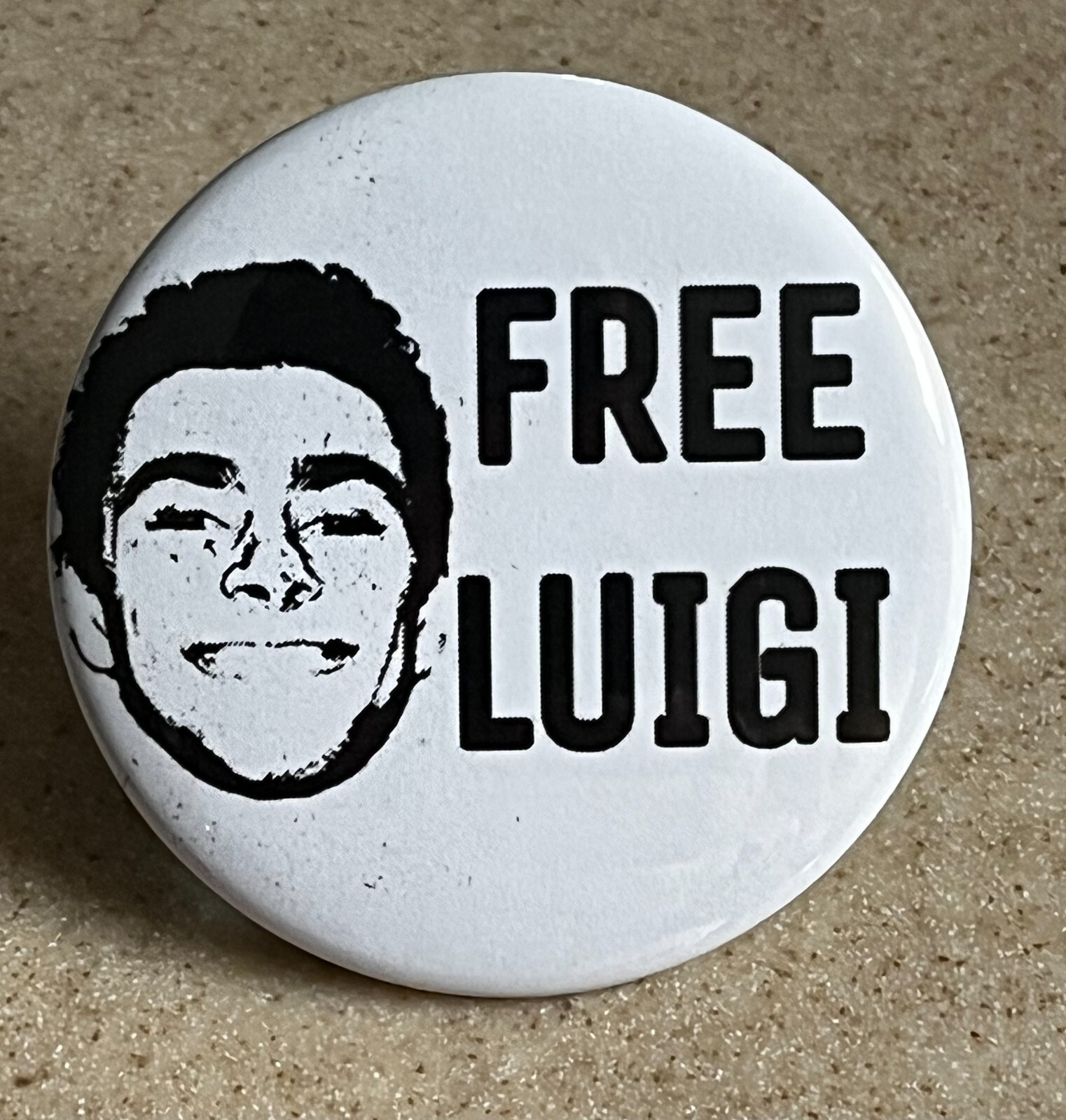 “Free Luigi” Pin-Back Button, 2 1/4 inch.