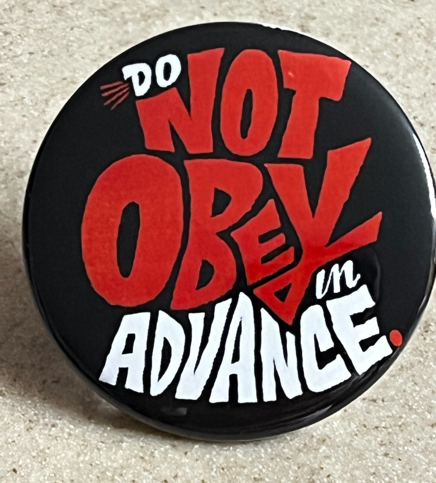 “Do Not Obey In Advance” Pin-Back Button, 2 1/4 inch.