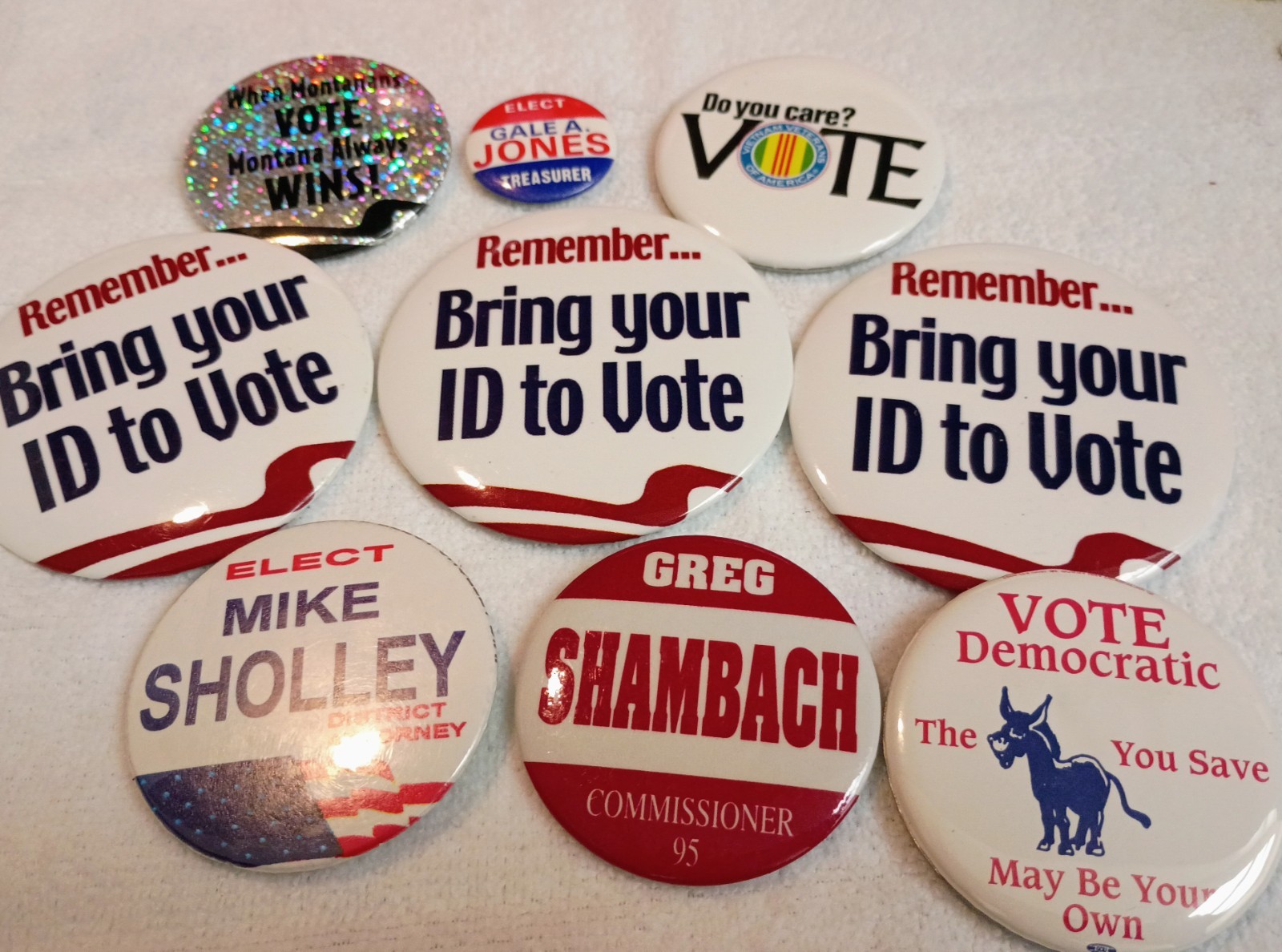Collection of modern political campaign and voter awareness buttons.