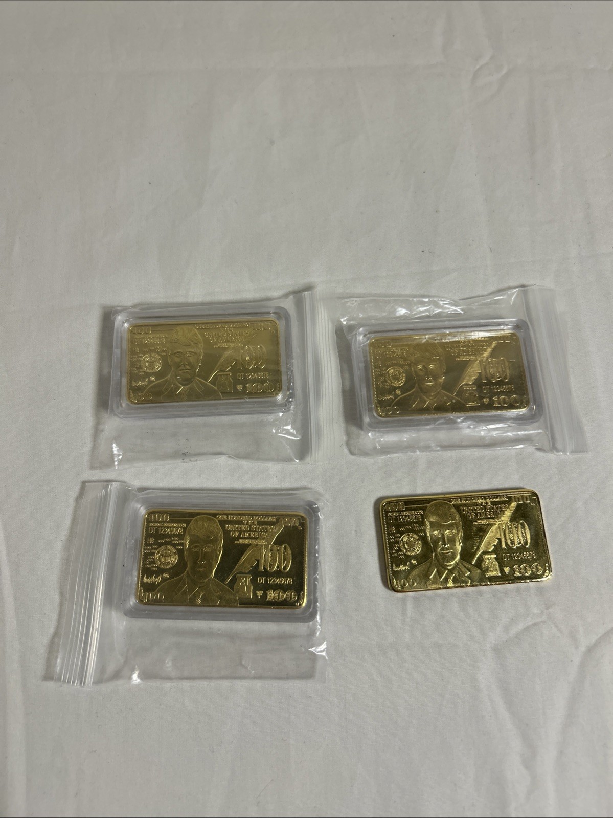 LOT of 4 DONALD TRUMP 24K GOLD PLATED $100 BAR COLLECTABLE – 3w/ PROTECTIVE CASE
