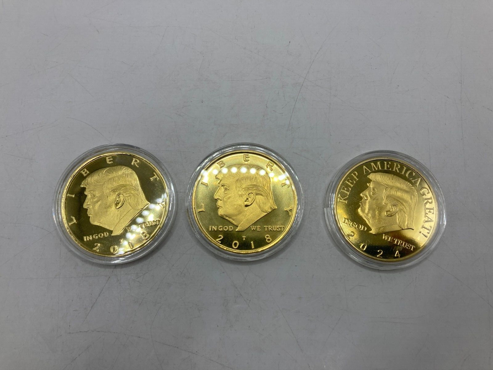 Lot of 3 45th President Donald Trump Coins – 2018 x 2, 2024 x 1