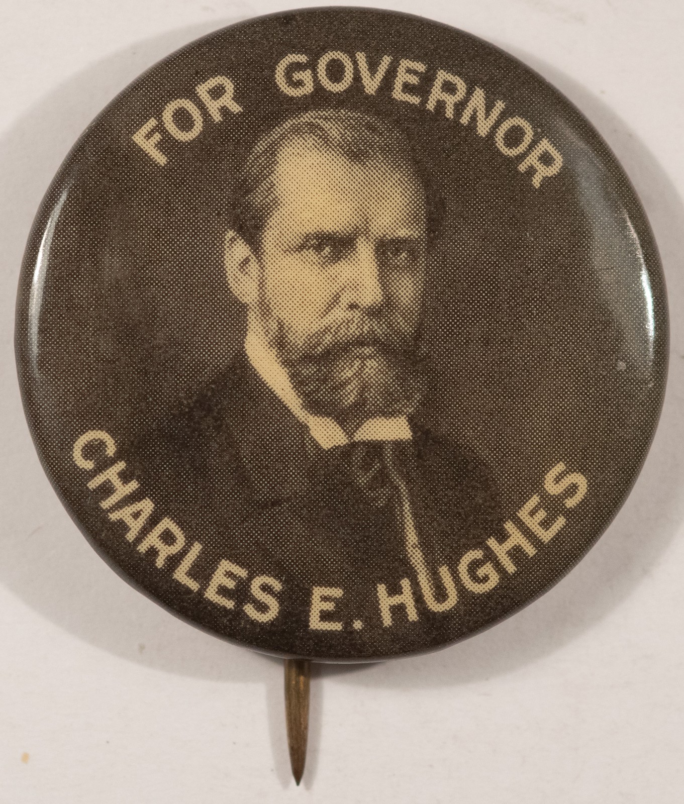 1906 CHARLES E HUGHES GOVERNOR 1 1/4″ CELLO – SCARCE, NEAR MINT!