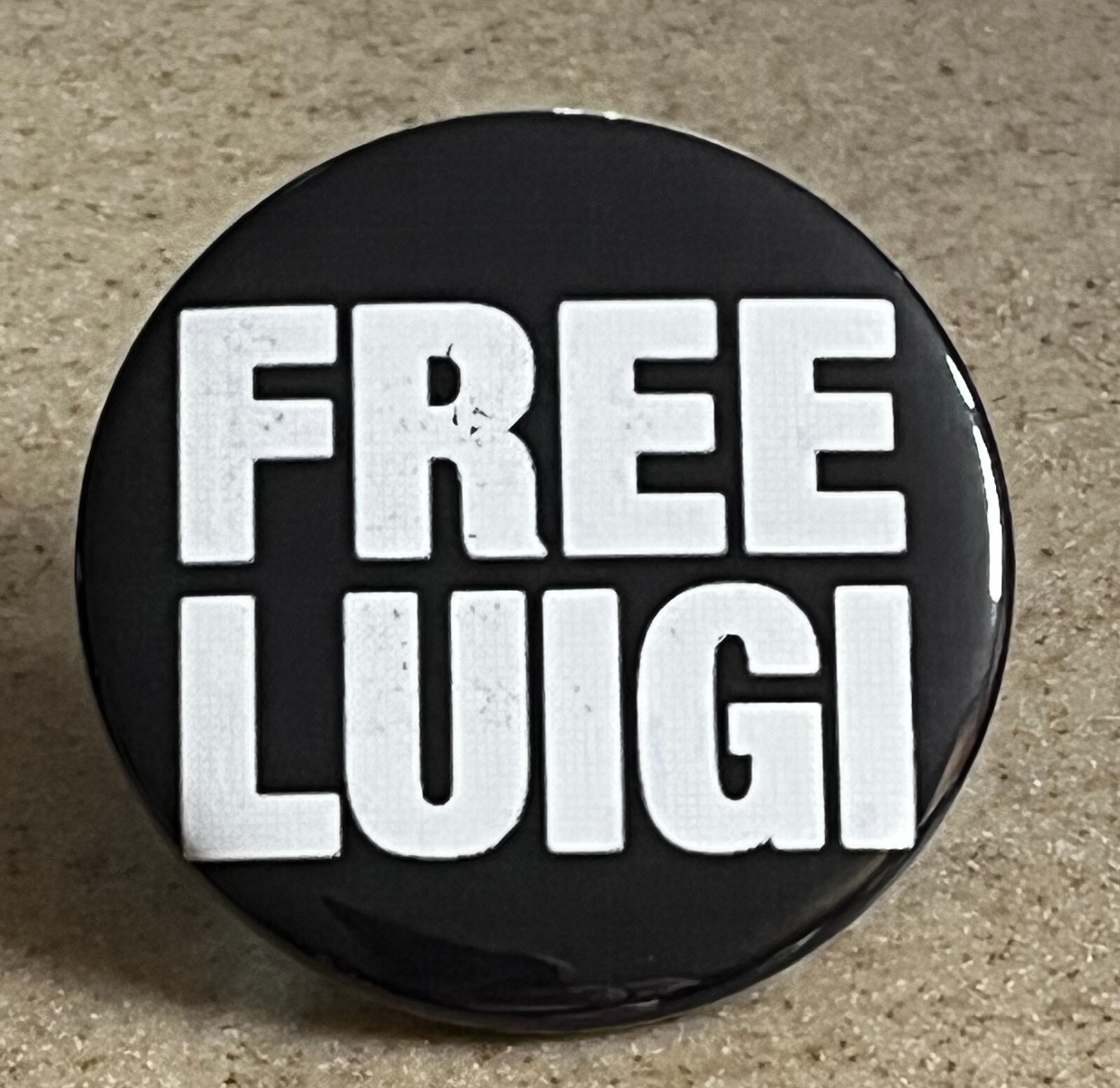 “Free Luigi” Pin-Back Button, 2 1/4 inch.
