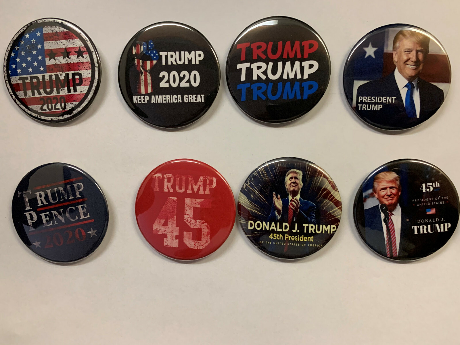 Trump 45 – Collectible Set of 8 Donald Trump pinback buttons (2.25 inches)