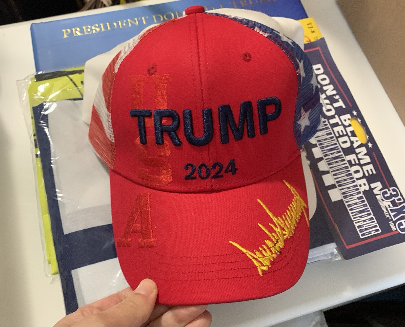 President Donald Trump Bundle Of Hats Flags And A Book