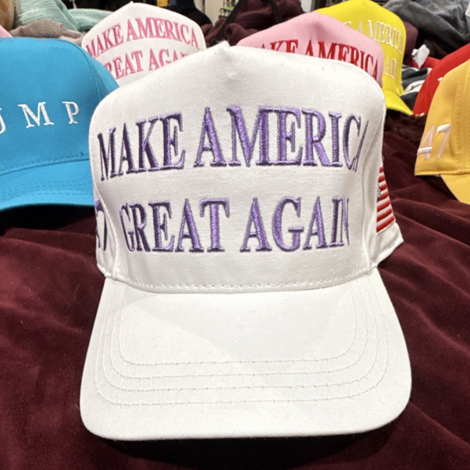 Cali-Fame Trump MAKE AMERICA GREAT AGAIN 2024 White & Purple Hat w/American Flag
