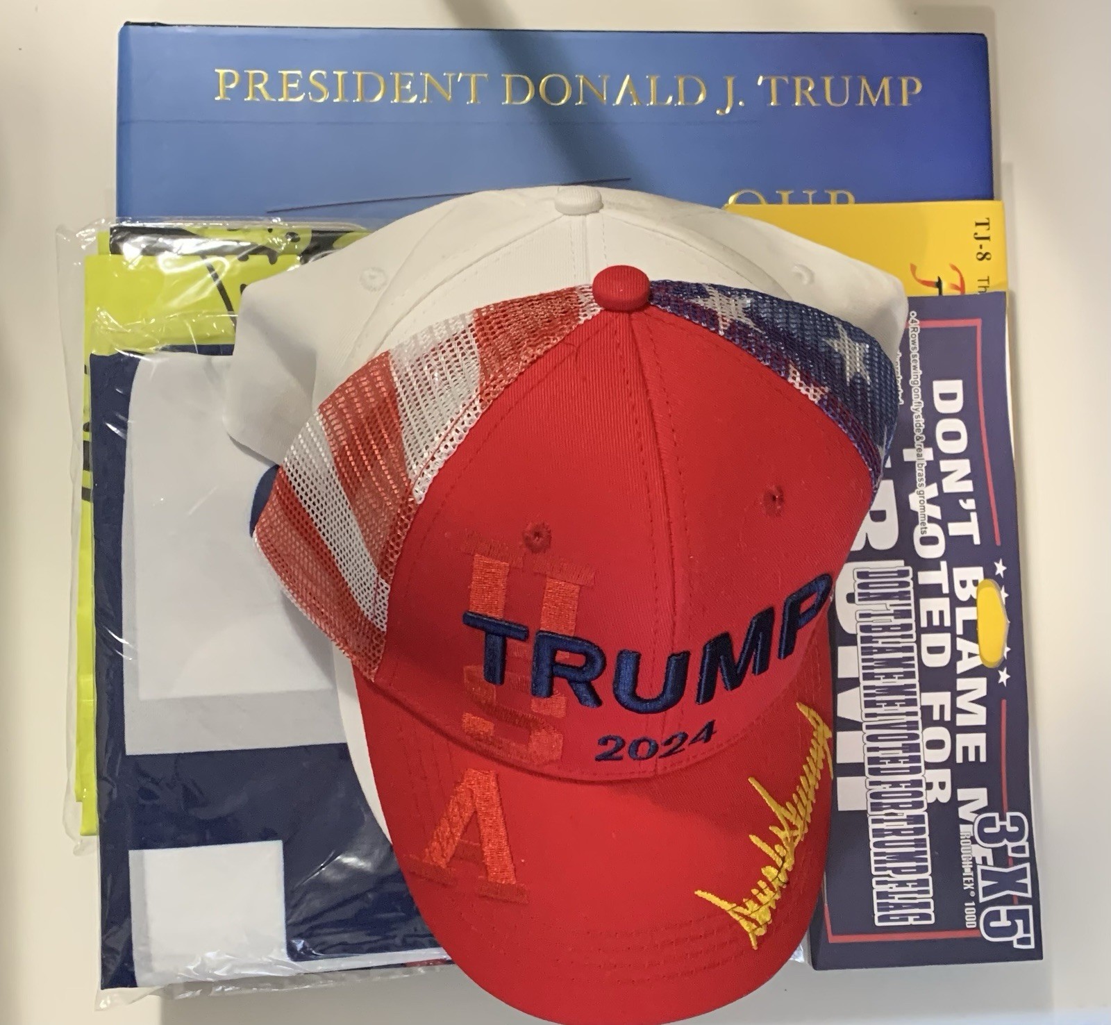 President Donald Trump Bundle Of Hats Flags And A Book