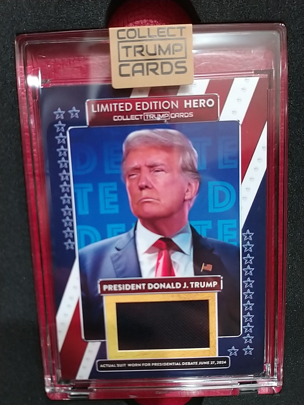 On Hand #256 Trump Official Trading Physical Card w/Piece “KNOCKOUT” DEBATE SUIT