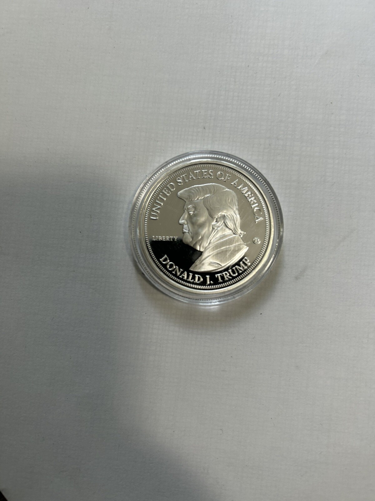 Two 2024 Donald J. Trump 99.9% Silver-Plated Proof Coins And 15 Coin Holder Case